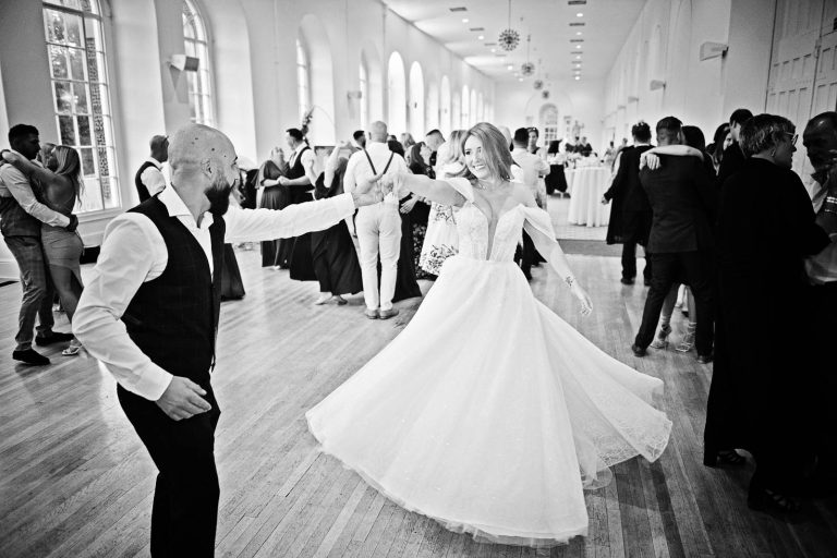 B&W photo of bride and groom dancing at Margam