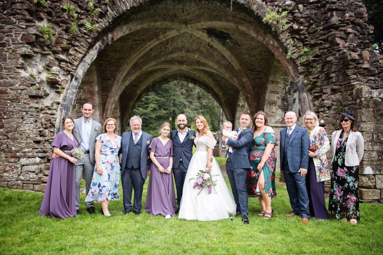 Relaxed family photo. Photo taken at a wedding in South Wales at Margam Country Park.