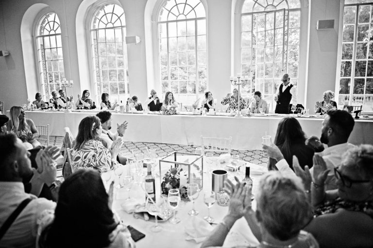 Natural B&W image taken during the wedding speeches at Margam.