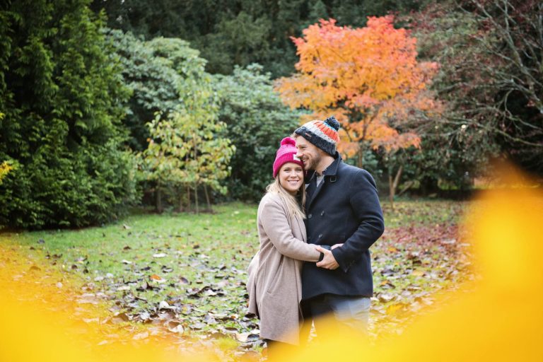 Candid photo of couple during their engagement shoot at Westonbirt Arboretum.