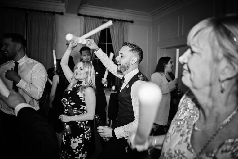 People dancing, black and white photo. Taken at Eastington Park at Christmas Wedding.