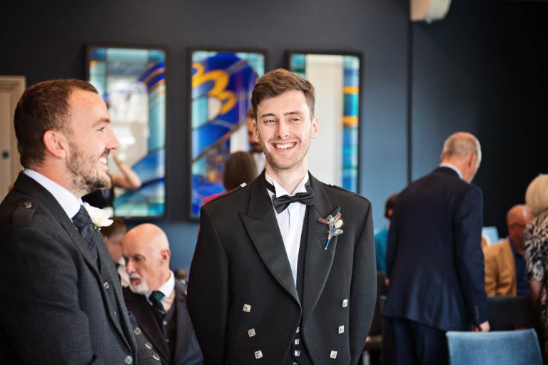 Groom atWinchester Registry Office Wedding, candid photo by Blooming Photography