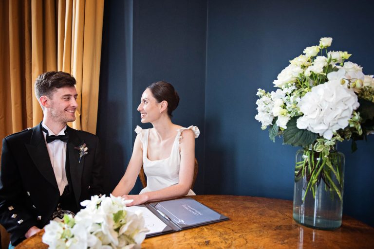 Bride and groom candid moments at Winchester Registry office, photo by Blooming Photography
