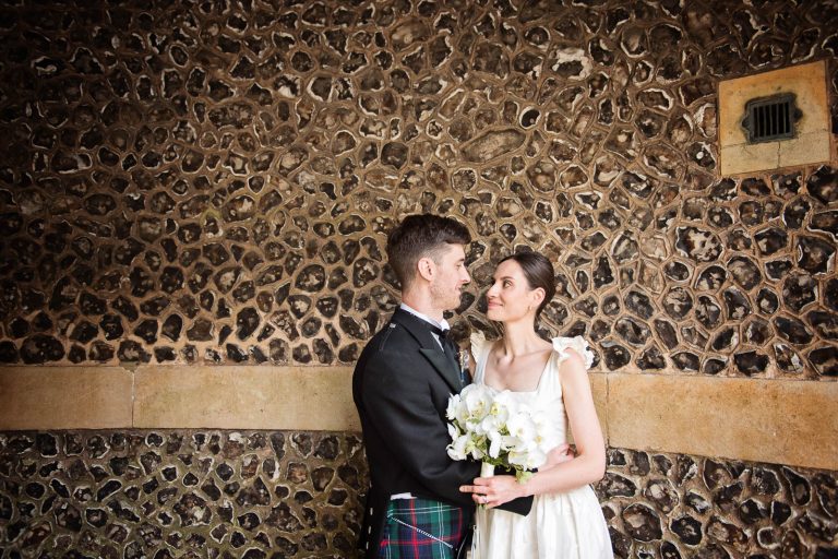 Candid wedding photo of bride and groom in Winchester, photo by Blooming Photography.