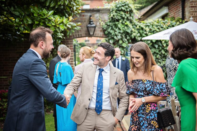 Candid wedding photo of guests at Hotel Du Vin Winchester, photo by Blooming Photography