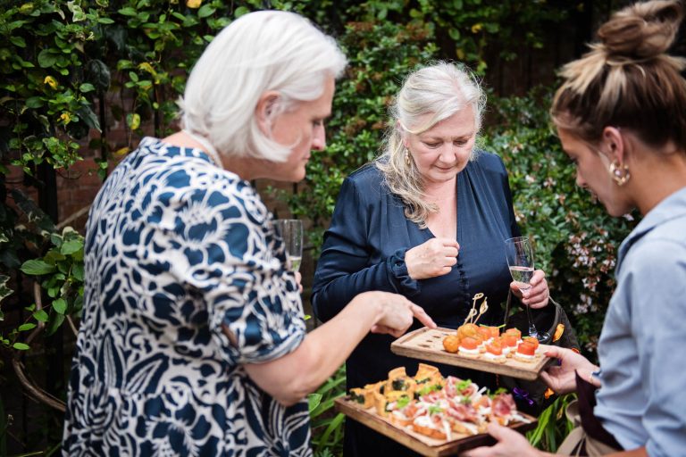 Storytelling wedding photo of guests choosing canopès Hotel Du Vin Winchester, photo by Blooming Photography