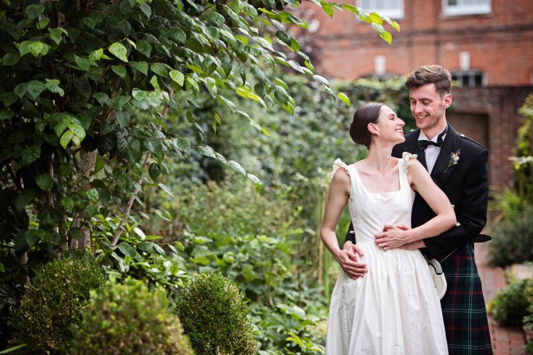 Candid portrait of Bride and Groom at a wedding at Hotel du Vin, Winchester. Photo by Blooming Photography.