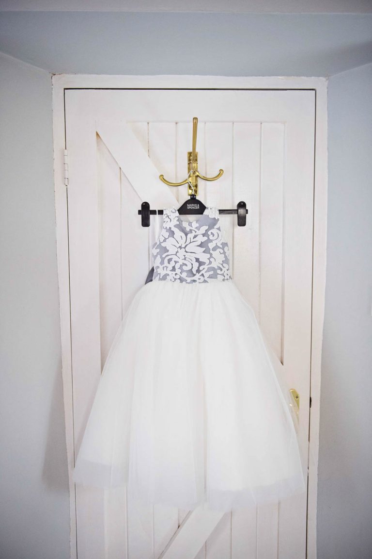 Flowergirl's dress hung up.