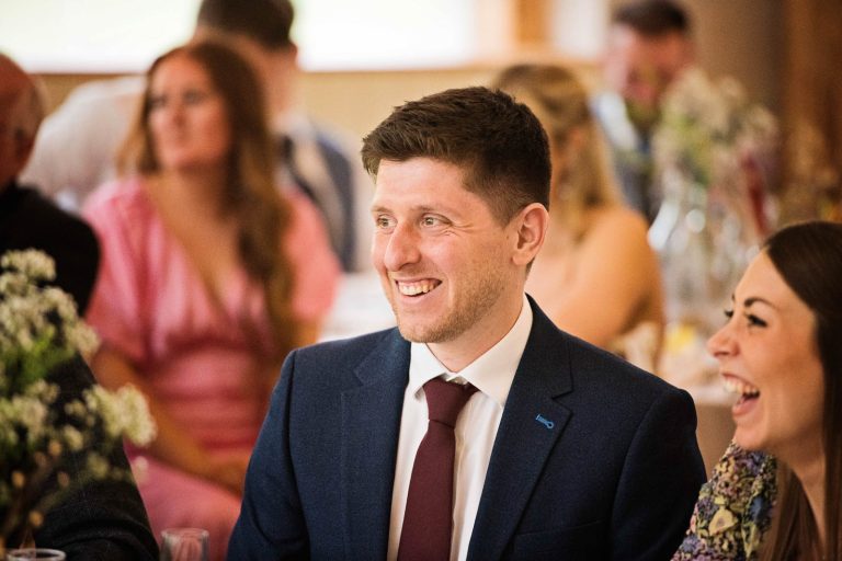 Candid photo of wedding speeches at Owlpen Manor