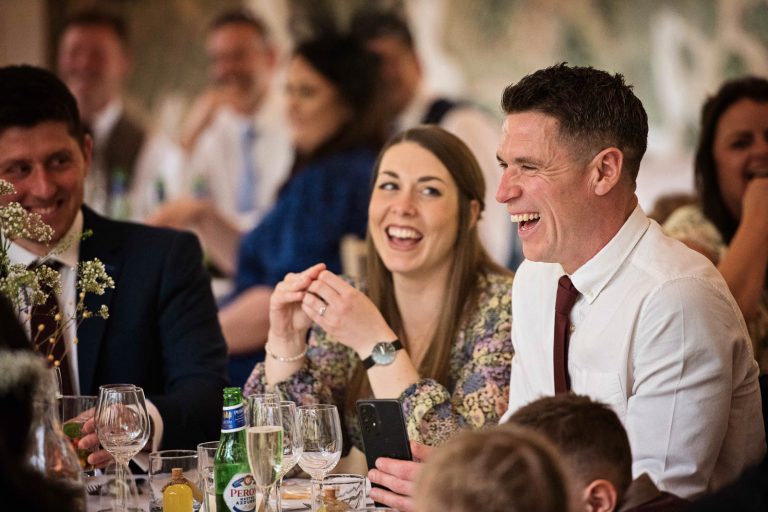 Candid photo of wedding speeches at Owlpen Manor