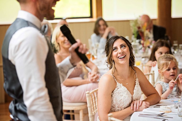 Bride listening to her husbands (grooms) speech.