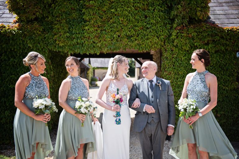 Team bride line up, just about to walk down the isle at Huntsmill Farm.