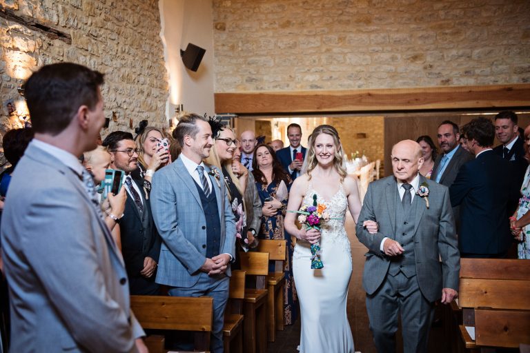 Bride walks down the wedding isle at Huntsmill Farm.