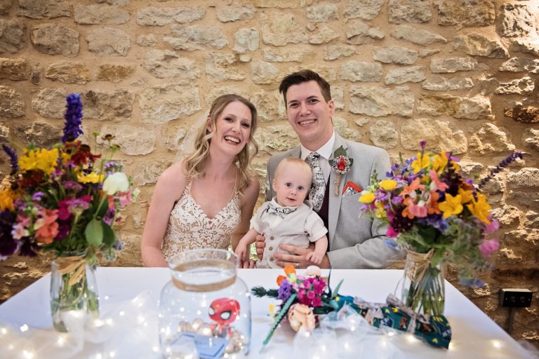 Bride and groom with their son after signing the register.