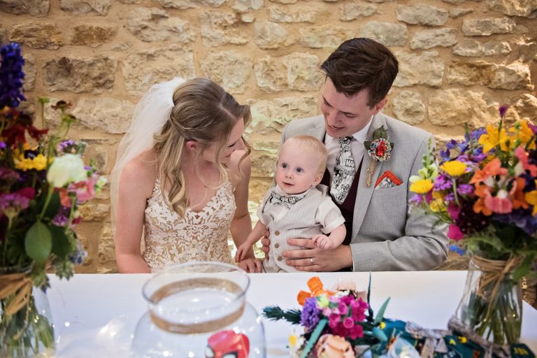 Bride and groom with their son after signing the register.