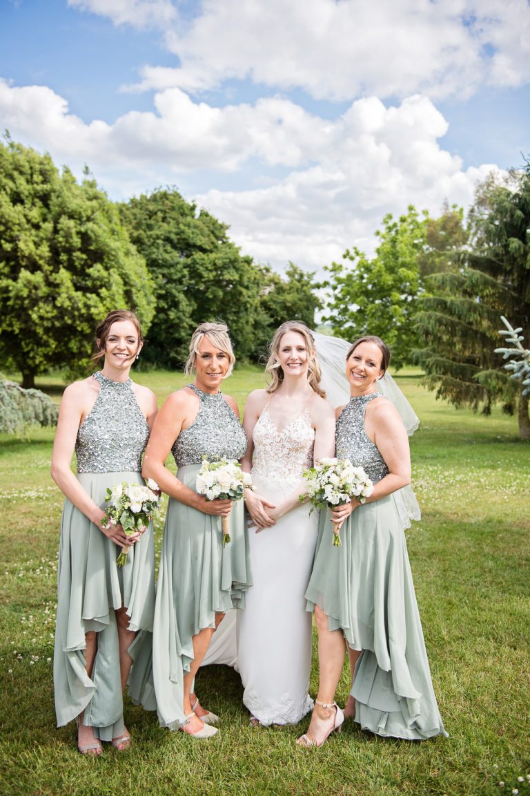 Team bride pose for a photo.