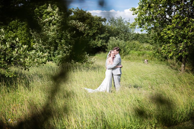 Relaxed wedding photography of bride and groom.