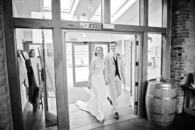 Bride and groom enter the wedding breakfast.