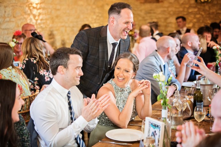 Guest laughing during wedding breakfast.