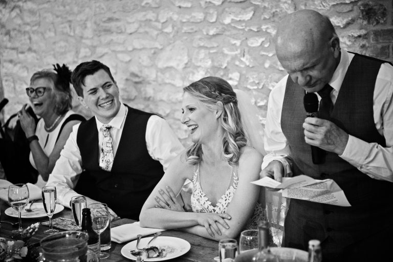 Documentary style wedding photo of father of the bride delivering his speech.