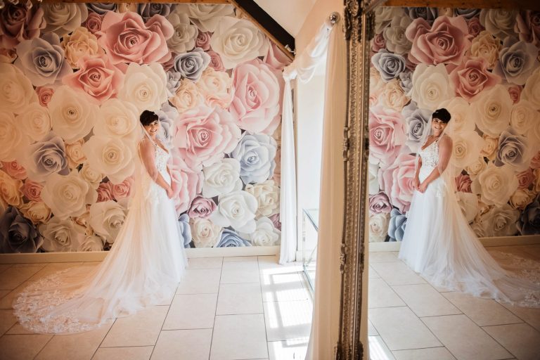 Reflective moment of bride before wedding at Kingscote Barn