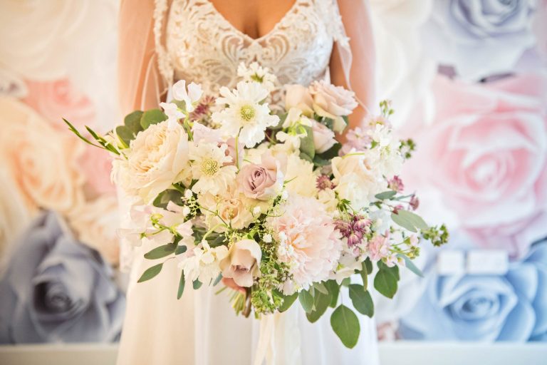 Flower bouquet being held by bride at Kingscote Barn