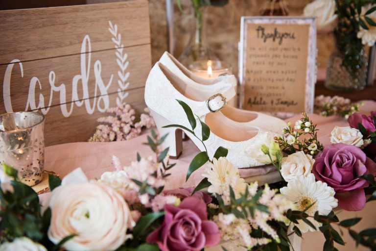 Wedding shoes and decor at Kingscote Barn