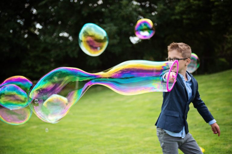 Storytelling wedding photo of children playing at Kingscote Barn.