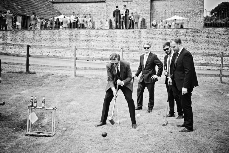 Games on the lawn captured candidly at Kingscote Barn