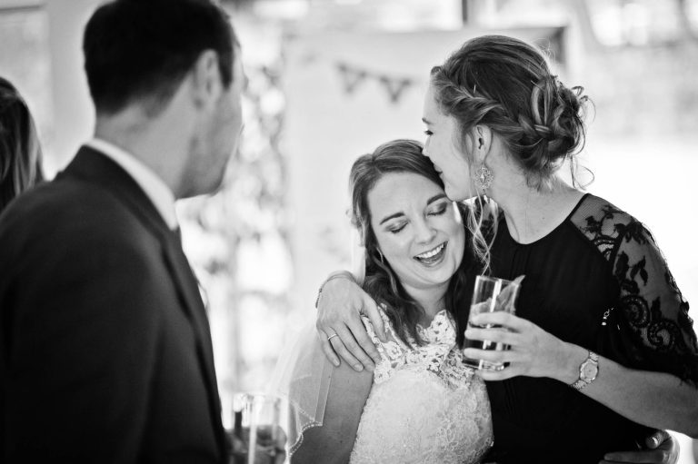 Unposed emotion wedding photo at Kingscote Barn