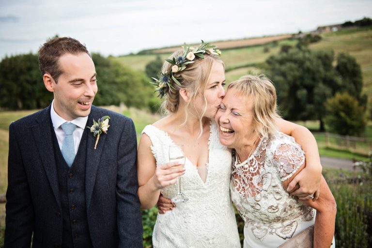 Natural unposed wedding photograph at Kingscote Barn, Gloucestershire.