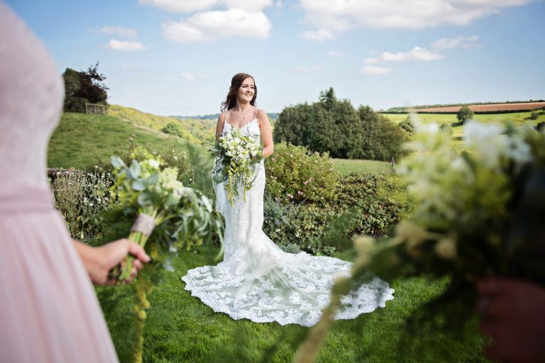 Natural moments of bride captured at Kingscote Barn