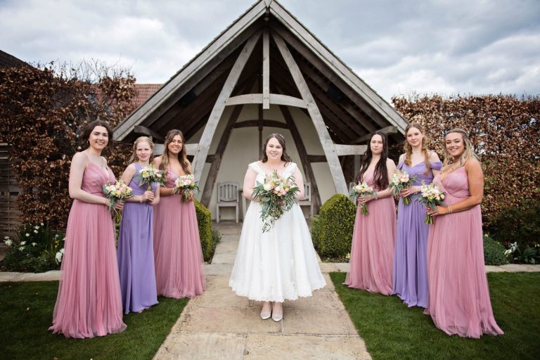 Bridal party Kingscote Barn outdoor wedding pose