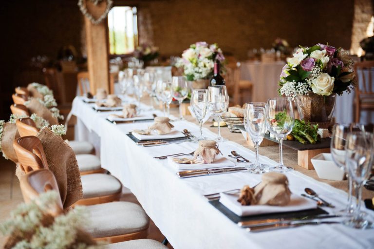 Wedding breakfast table set up Kingscote Barn