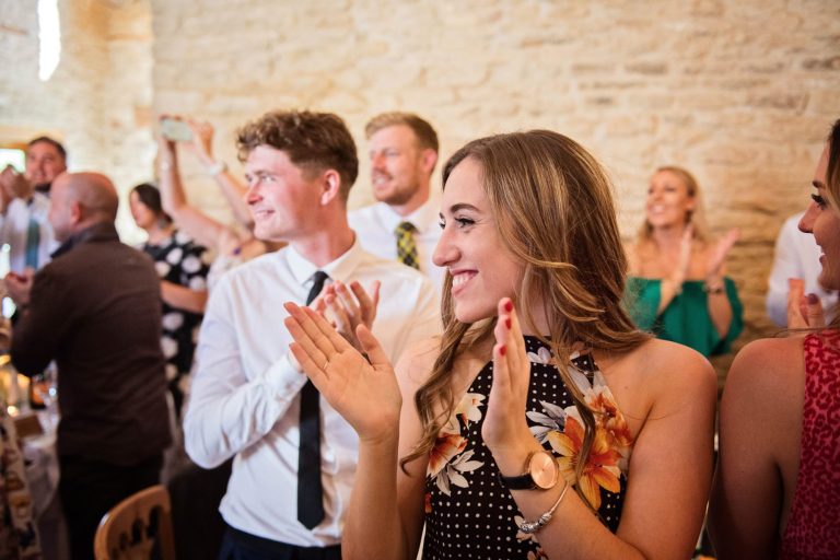 Candid wedding photo taken at Kingscote Barn.
