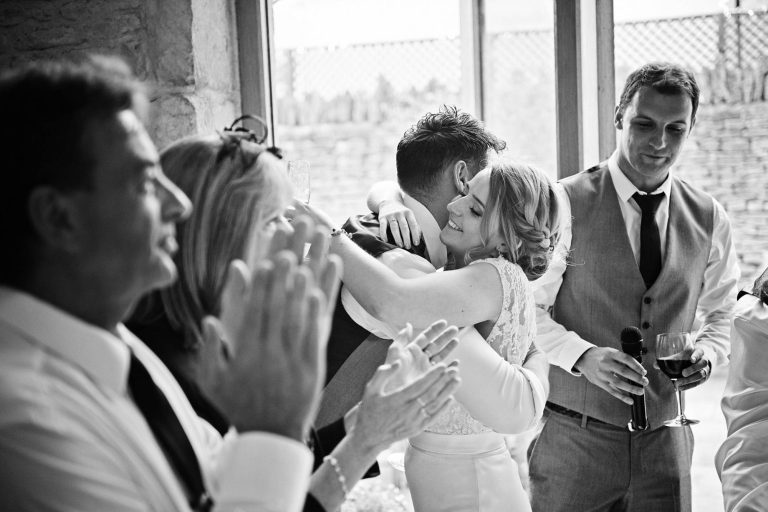 Storytelling emotional wedding photo at Kingscote Barn taken by Blooming Photography