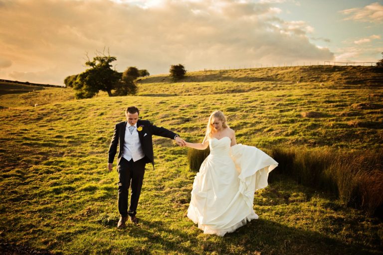Unposed sunset wedding photos at Kingscote Barn (
