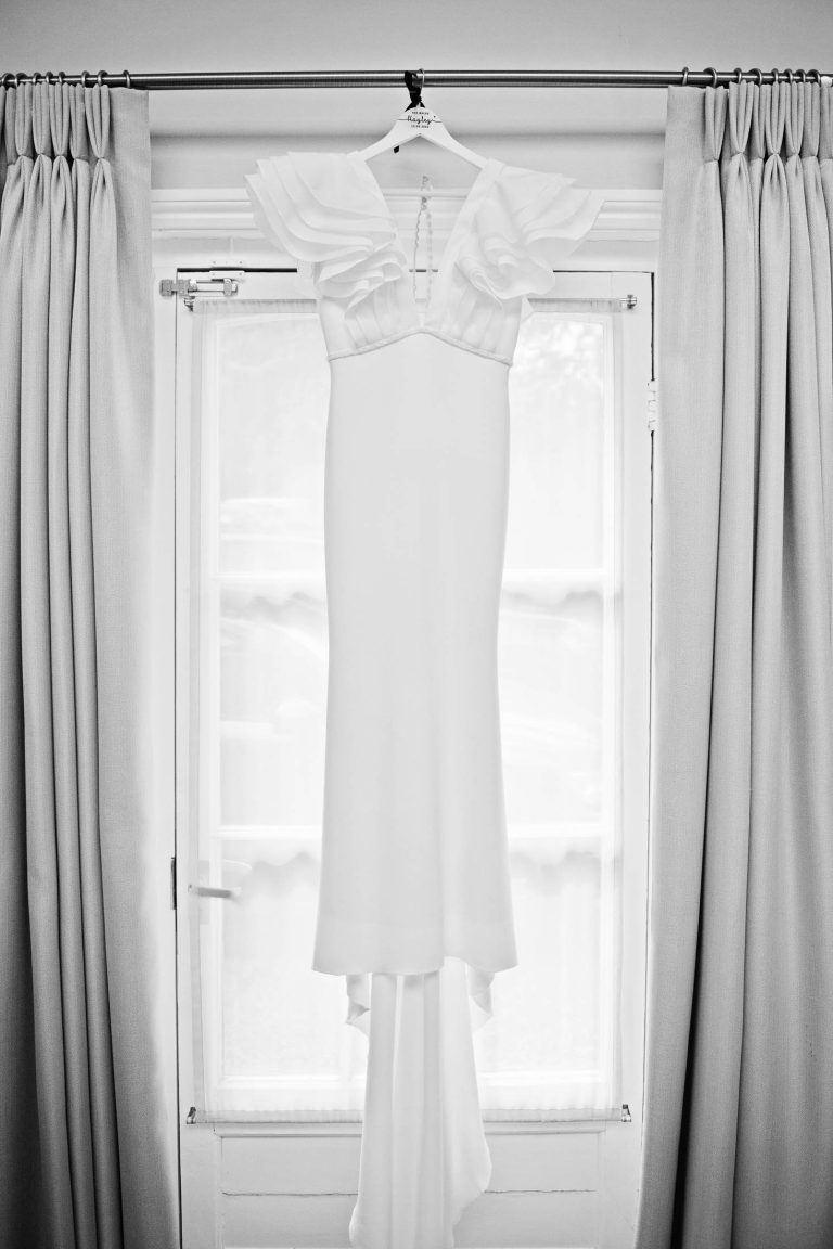 Wedding dress hung up.