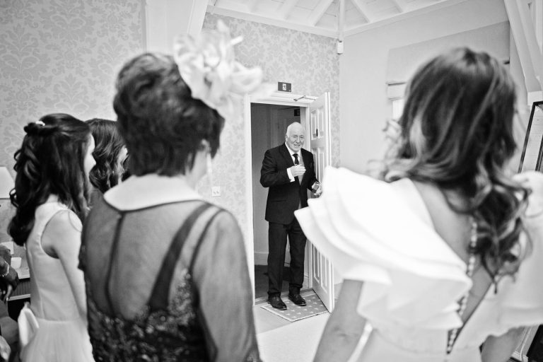 Candid photo of the father of the bride getting emotional as he see's his daughter for the first time at Syrencot.