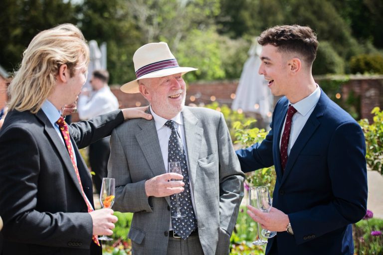 Candid photo of wedding guests. enjoying each others company.