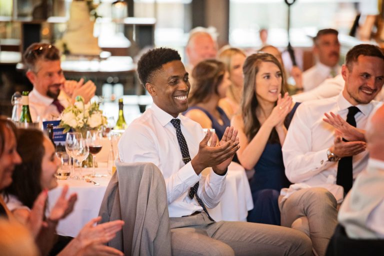 Wedding guests clapping.