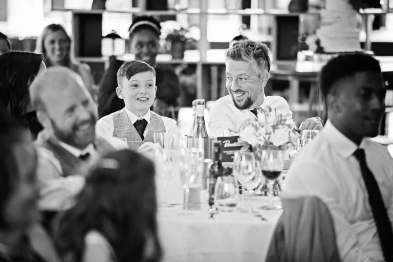 Wedding guest listening to wedding speeches.