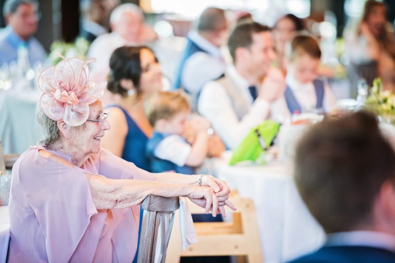 Wedding guest listening to wedding speeches.