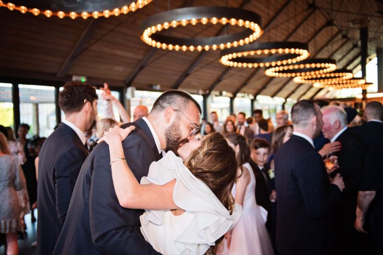 Bride and groom kiss after their first dance at Syrencot