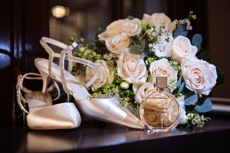Details of shoes, flowers and perfume.