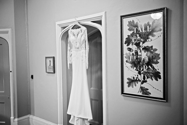 Brides dress hung up.