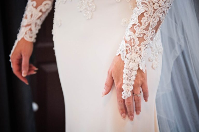 Close up of the brides wedding dress. Lace.