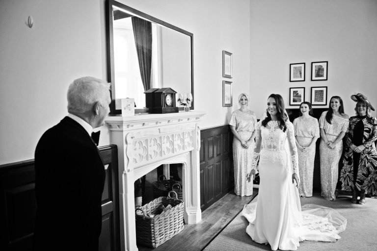 Bride seeing her father for the first time in her wedding dress aty Tortworth Court.