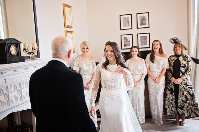 Bride seeing her father for the first time in her wedding dress at Tortworth Court.