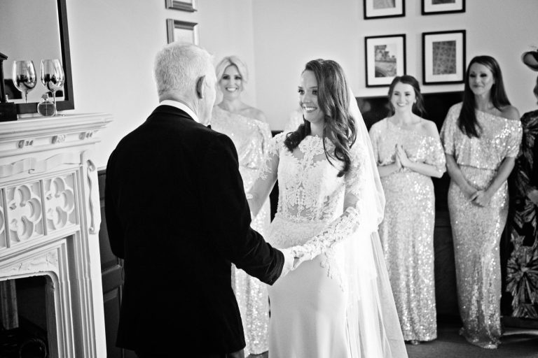 Bride seeing her father for the first time in her wedding dress at Tortworth Court.